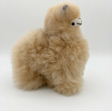 Front view of a 6inch small natural white alpaca llama made from undyed Huacaya fur.