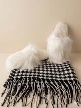 Premium 100% baby alpaca throw blanket in black and white houndstooth pattern with white alpaca fur slippers.
