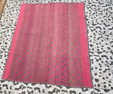 Vintage Peruvian Frazada rug No. 113 — hand-loomed in Cusco from hand-spun sheep wool in two-tone fuchsia and warm grey full-field diamond eye weave with solid fuchsia border panels and teal indigo whipstitch edge, 60 by 67 inches