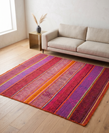 Archival Textile No. 102: An unusually saturated fuchsia and clementine vintage Frazada. This one-of-a-kind Peruvian wool rug features hand-spun sheep wool and symmetrical stripes, ideal for modern interior design and textile art collections