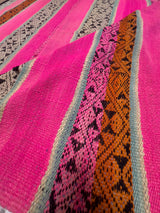 Close-up of Archival Textile No. 111 showing intricate zoomorphic and geometric pallay symbols specific to the Maras weaving community woven in earth-toned ochre and cream