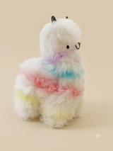 Sherbet Llama — 6" handmade alpaca stuffed animal with a white base and pastel pink, blue, purple, and yellow hand-dyed accents, Andean Puff™ collection, handmade in Peru"