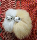 alpaca-bag-charm-hanging-on-leather-tote-bag