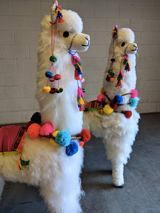 Large white alpaca llama plush with colorful pompoms handmade in Peru, luxury minimalist nursery decor accent