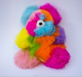 Detail of soft hand-dyed rainbow alpaca fiber on a limited edition stuffed bear.