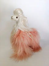 Front view of 12 inch bicolor pink and white Suri alpaca with long silky hair and glass eyes