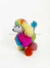 A high-end product collage of Inspired Peru's handmade rainbow alpaca plush collection, featuring a pastel poodle, multi-color lion, and teddy bear stuffed animals against a seamless light-beige studio background. Text reads: "Unique & Handmade: From the Heart of the Andes | Aesthetic Comfort in Vivid Pastels