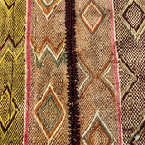 Technical detail of the central hand-stitched join on a vintage Andean Frazada, showcasing heritage weaving techniques and structural integrity.