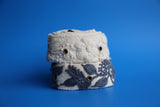 Hand-woven grey wool belt with colorful floral embroidery from Peru.